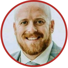 A man with a beard is smiling in a circle.