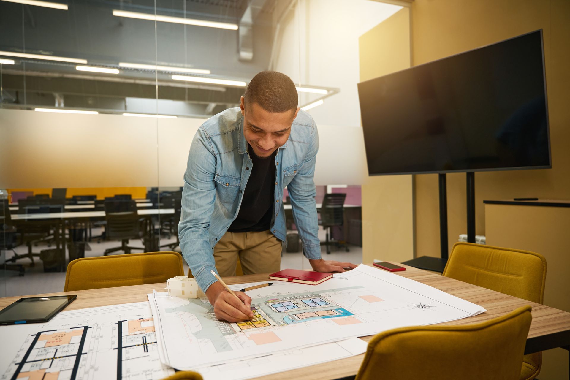 Commercial remodeling contractor finalizing layout plans for commercial office remodel project