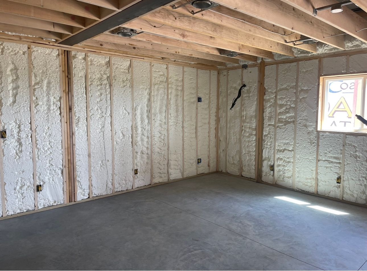 Close up Of a Wall with Foam Insulation — Nebraska City, NE — Midwest Custom Coatings