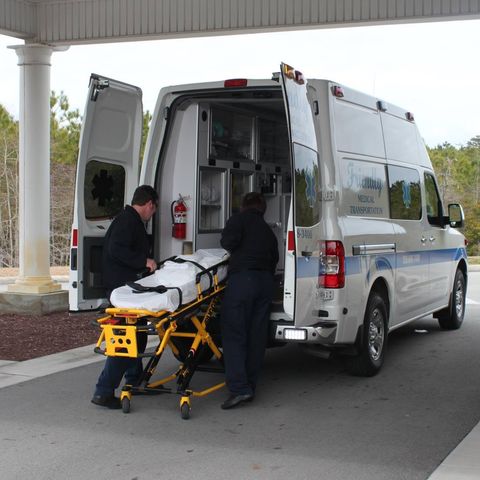 Emergency Team Loading the Stretcher — Morehead City, NC — Friendly Medical Transportation