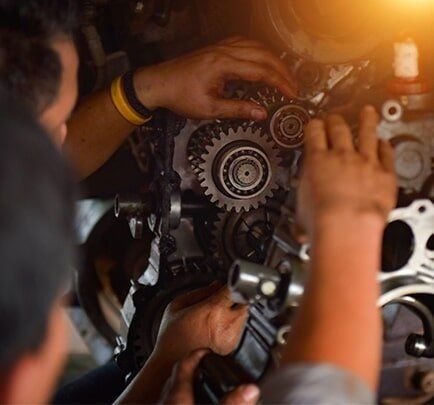 Mechanics Work on a Complex Engine's Internal Gears and Chain — AWE Engineering in South Lismore, NSW