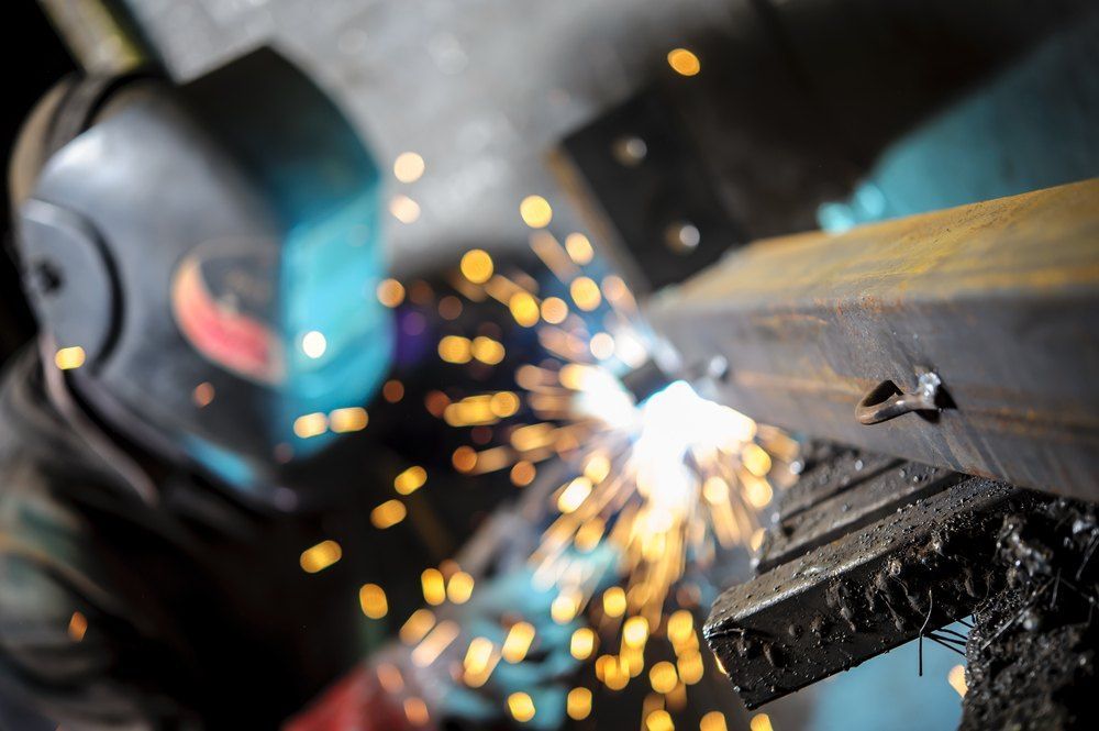 A Close Up of a Person Welding Metal With Sparks — AWE Engineering in South Lismore, NSW