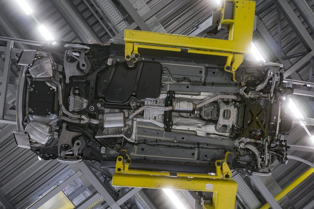 A Close Up of a Car Engine in a Factory With a Yellow Frame — AWE Engineering in South Lismore, NSW