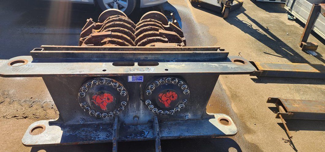 A Rusty, Heavy-duty Industrial Grinder Sits on the Ground — AWE Engineering in South Lismore, NSW

