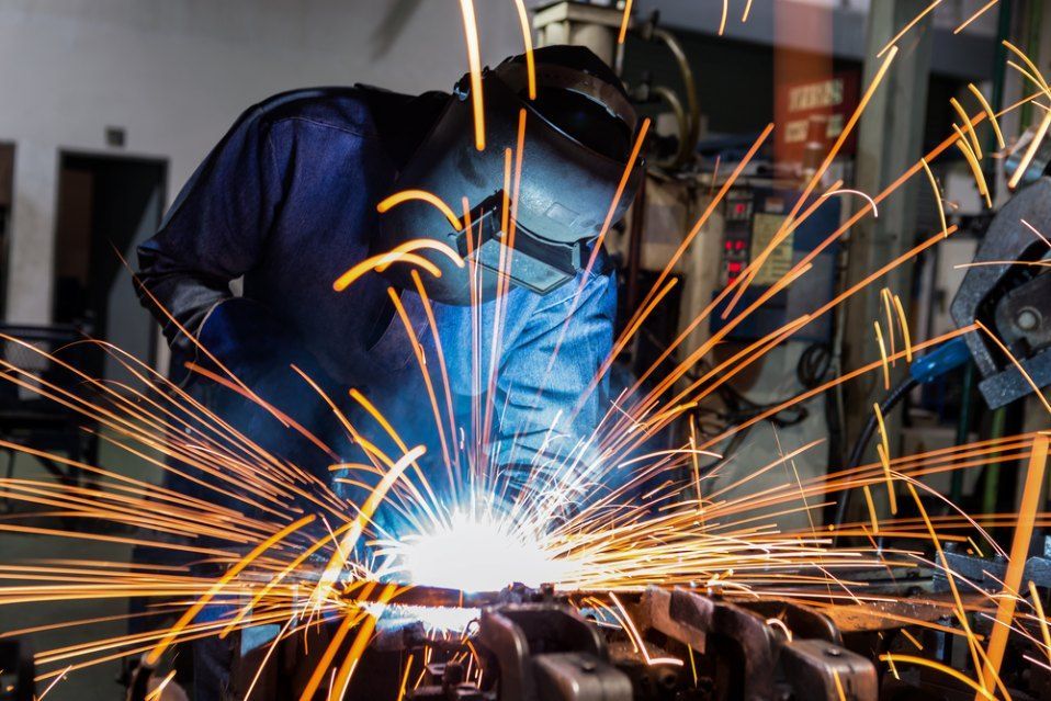 A Close Up of a Person Welding Metal With Sparks — AWE Engineering in South Lismore, NSW