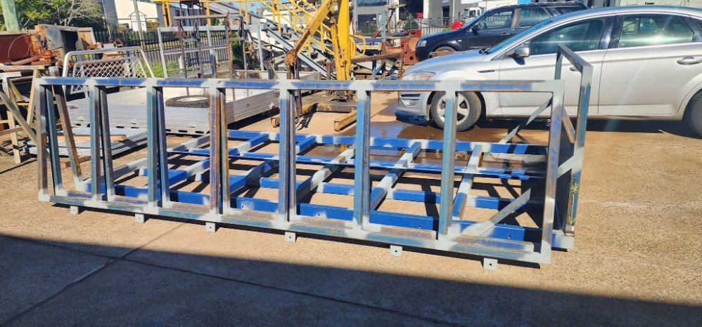 A Close Up of a Metal Cage With a Car in the Background — AWE Engineering in South Lismore, NSW