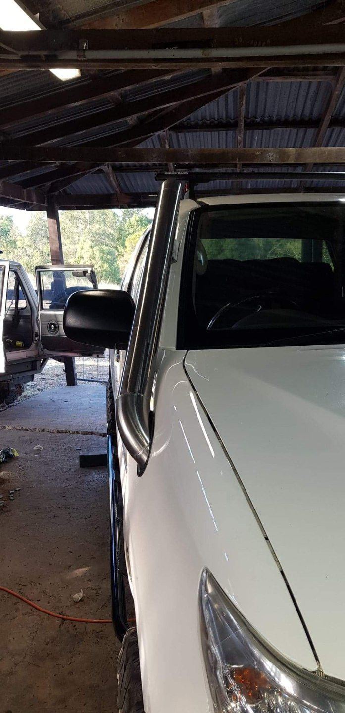 Two Cars Parked in a Garage With a Man Standing Next to Them — AWE Engineering in South Lismore, NSW