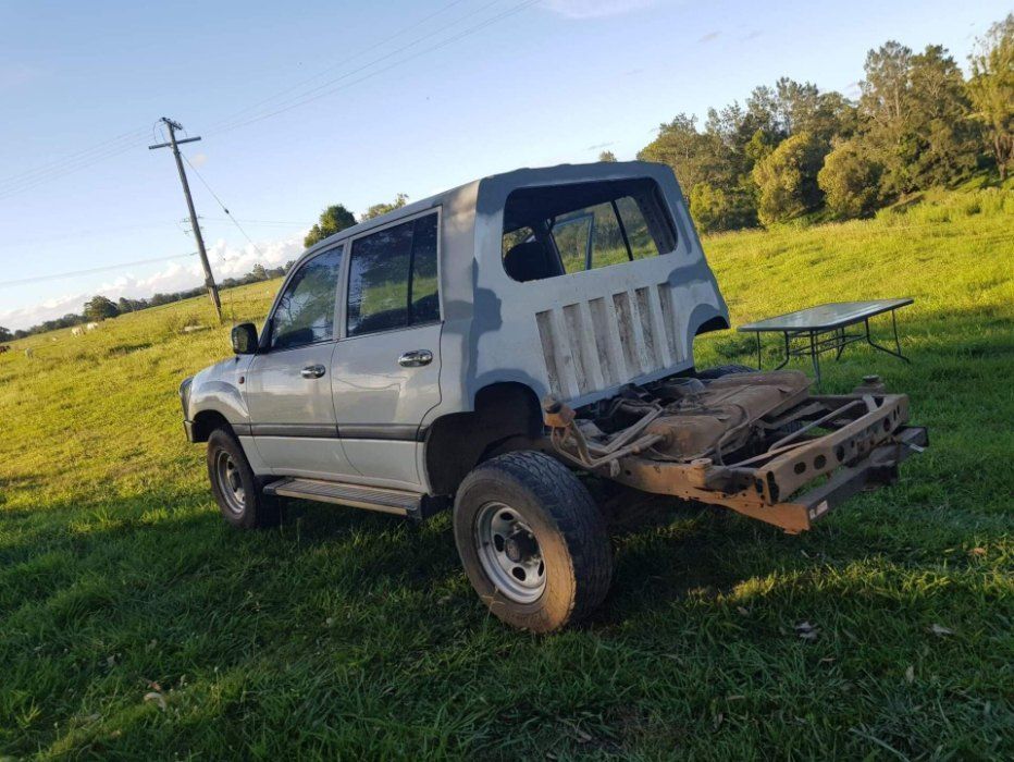 Arafed Vehicle With A Broken Hood Sitting In A Field — AWE Engineering in South Lismore, NSW