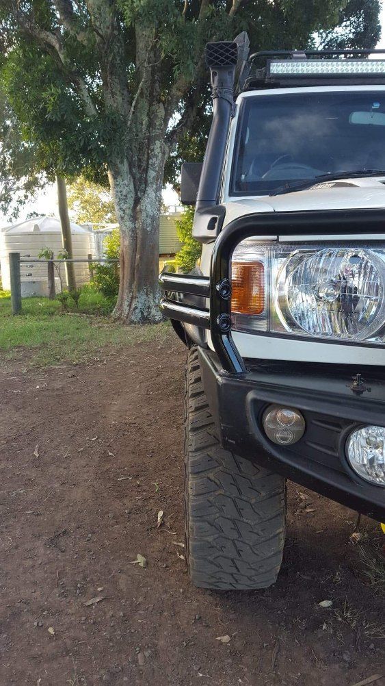 Close-up of a Toyota Land Cruiser's Front Bumper and Tire — AWE Engineering in South Lismore, NSW