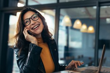 Happy Woman Having a Conversation — United States — Your Phone Buddy