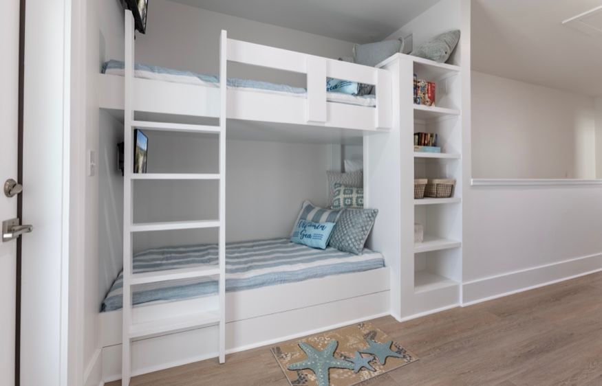 Built in twin size bunks, each with their own tv, at Rest Ashore in Gulf Shores, Alabama