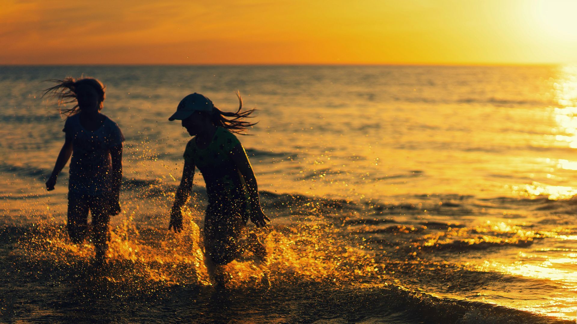 Children playing in waves at beach at Gulf Shores, Alabama