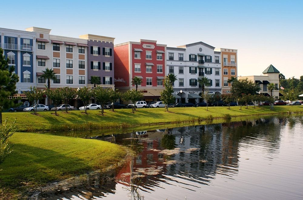 A row of buildings next to a body of water