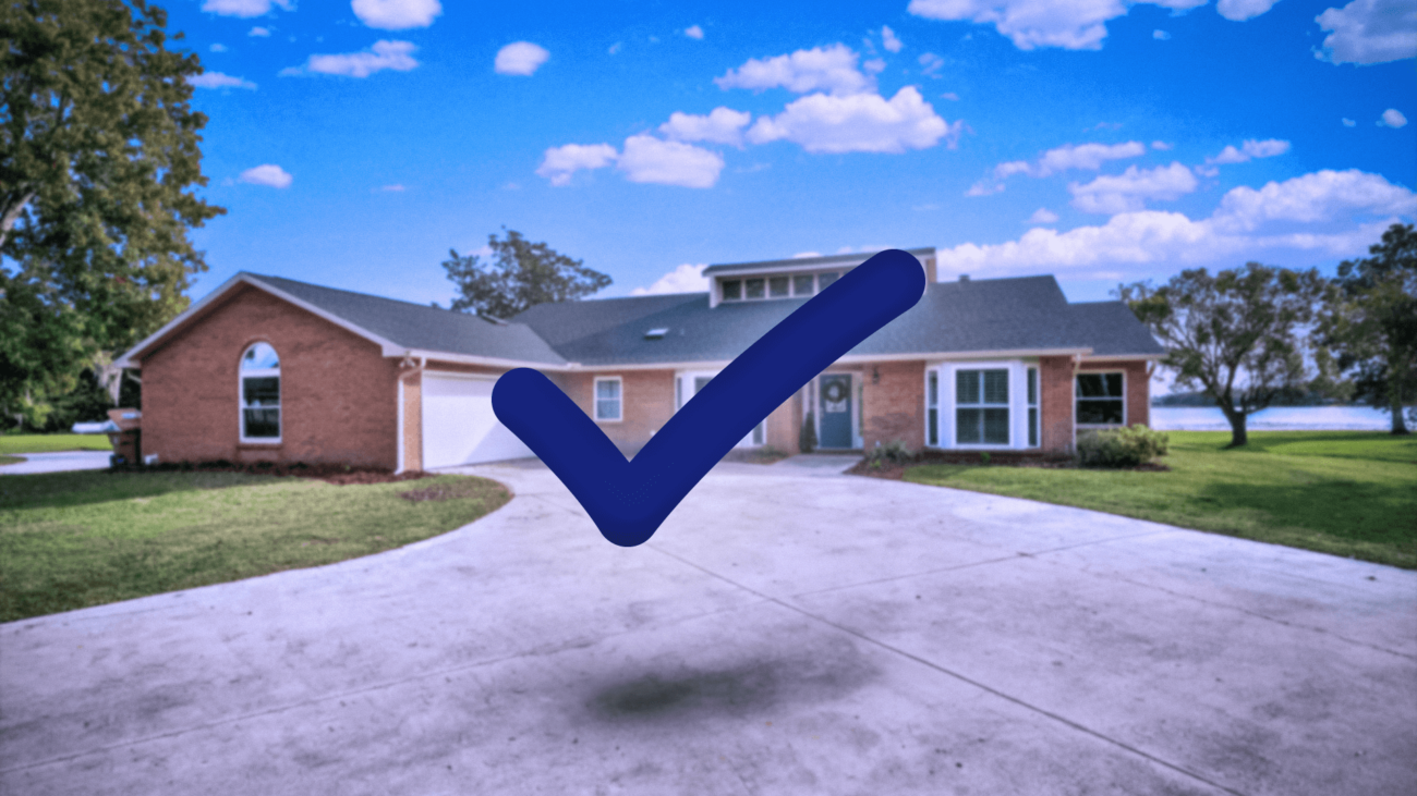 A house with a blue check mark in front of it.