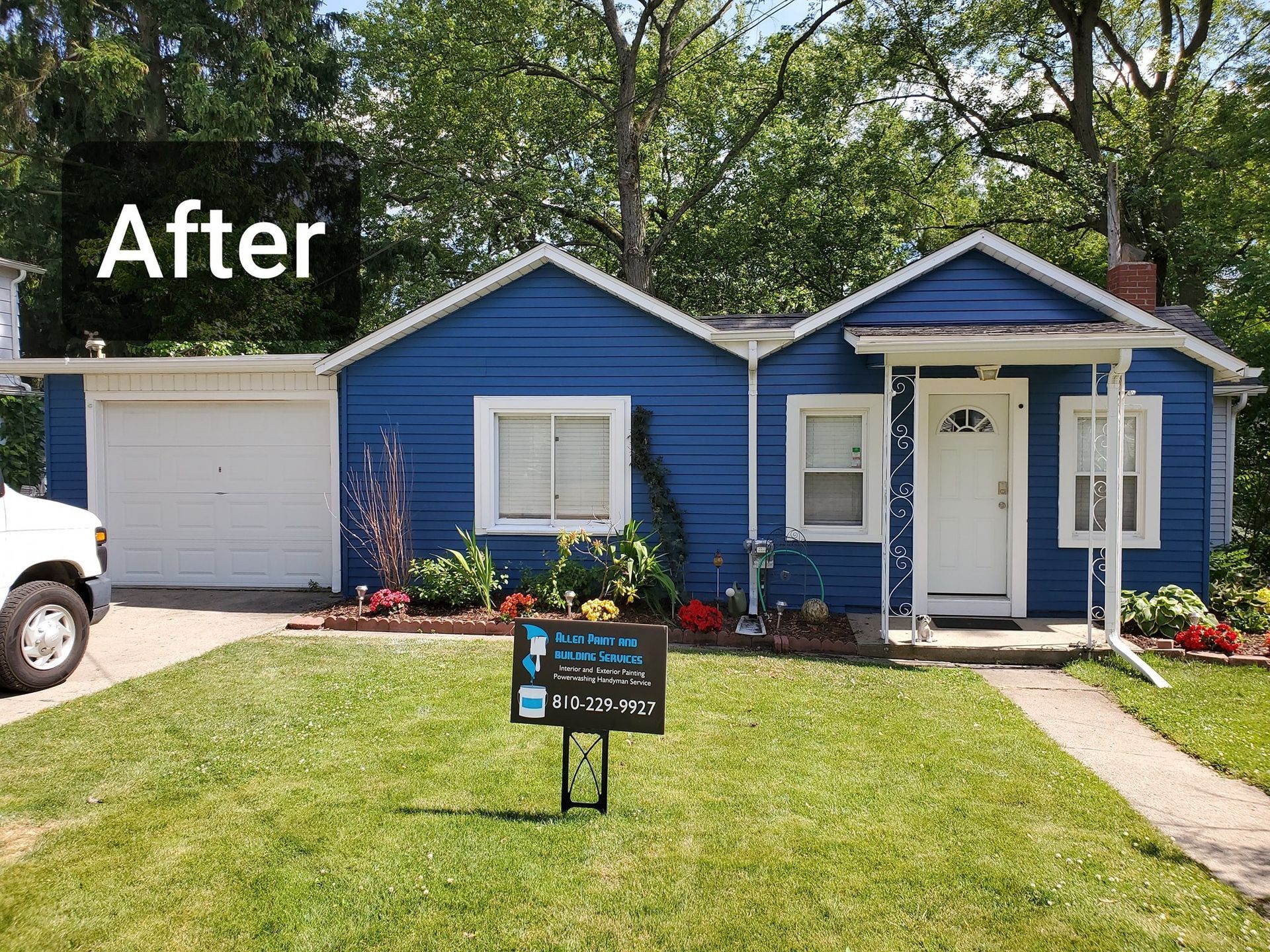 A blue house with a sign in front of it that says after