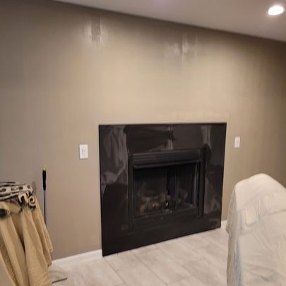 There is a fireplace in the middle of the room.