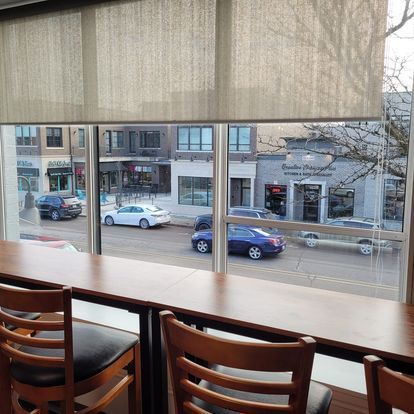 A view of a city street from a restaurant window