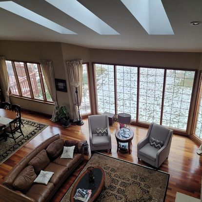 An aerial view of a living room with a couch and chairs