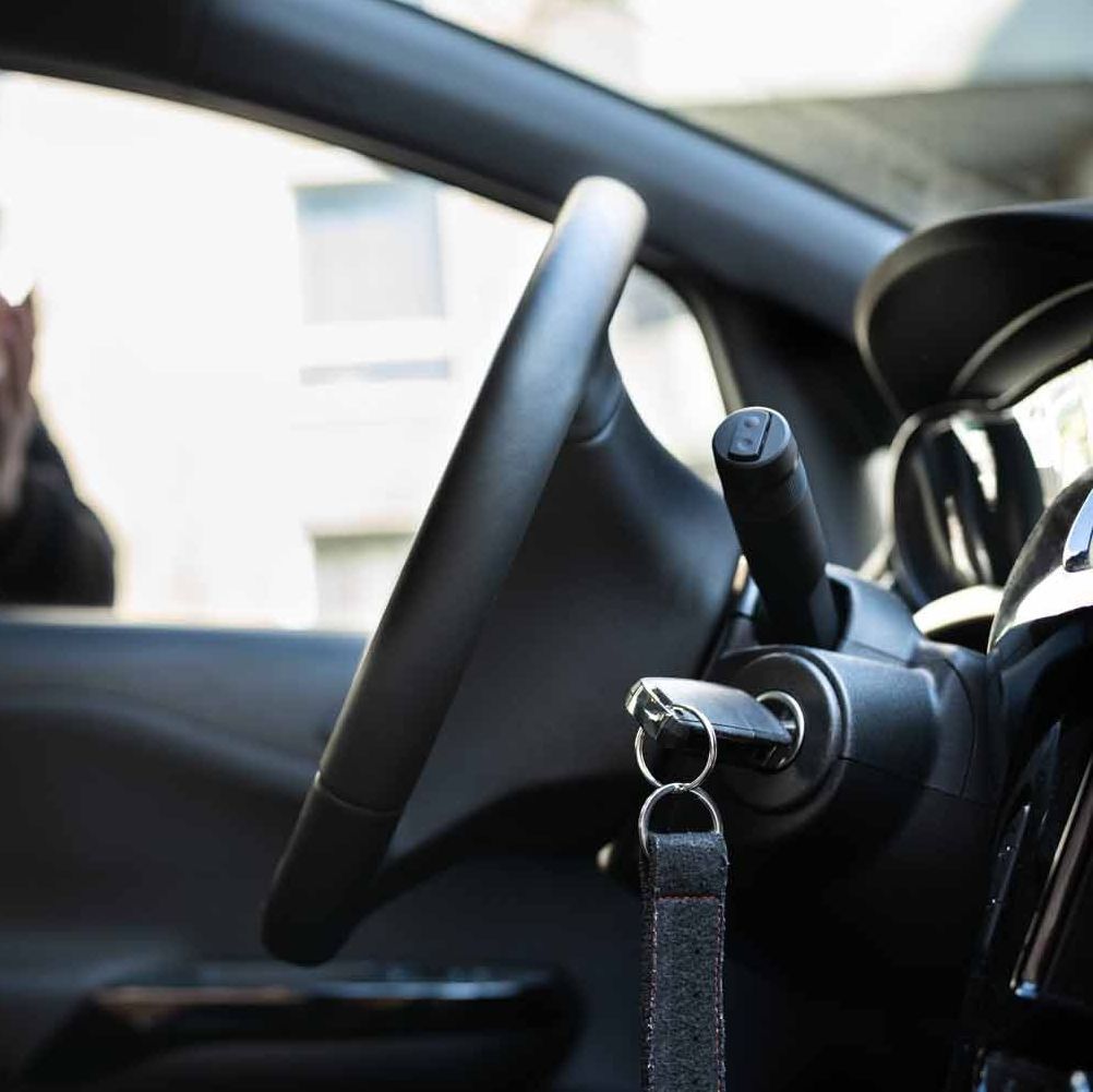 A close up of a car with a key in the ignition