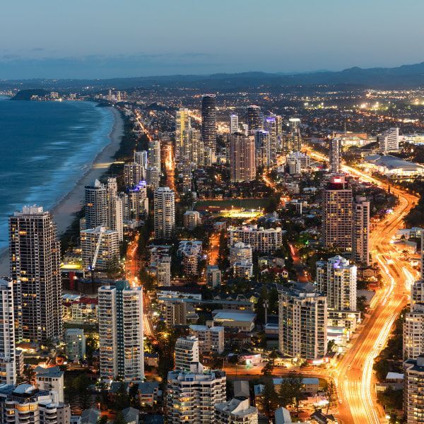 an aerial view of a Broadbeach night with a beach in the background - mortgage broker gold coast