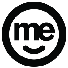 A black and white logo with the word me and a smiling face in a circle.
