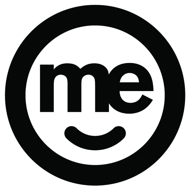 A black and white logo with the word me and a smiling face in a circle.