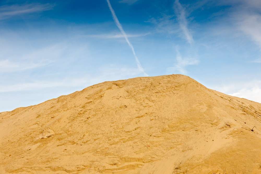 A Large Pile Of Sand Against A Blue Sky — HKL Landscape Supplies in Wingham, NSW 