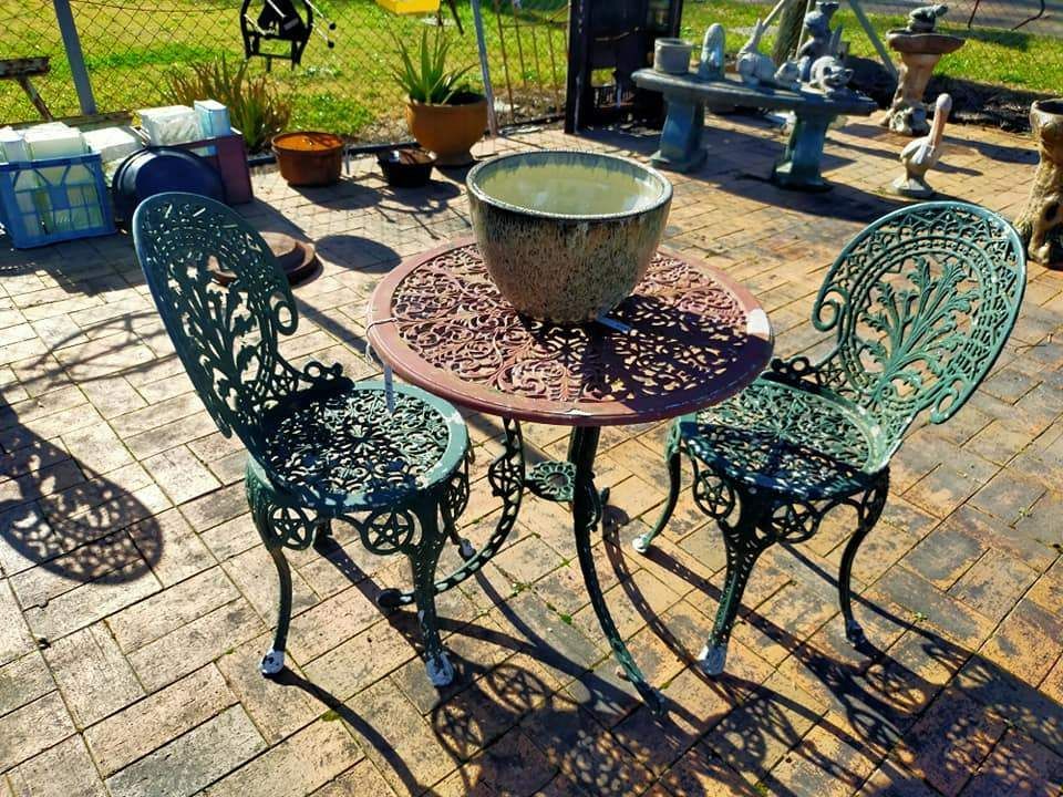 A Table And Chairs Are Sitting On A Brick Patio — HKL Landscape Supplies in Taree South, NSW