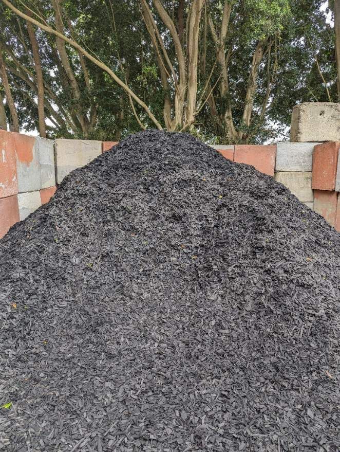 A Pile of Black Gravel is Sitting on Top of a Pile of Bricks — HKL Landscape Supplies in Nabiac, NSW 