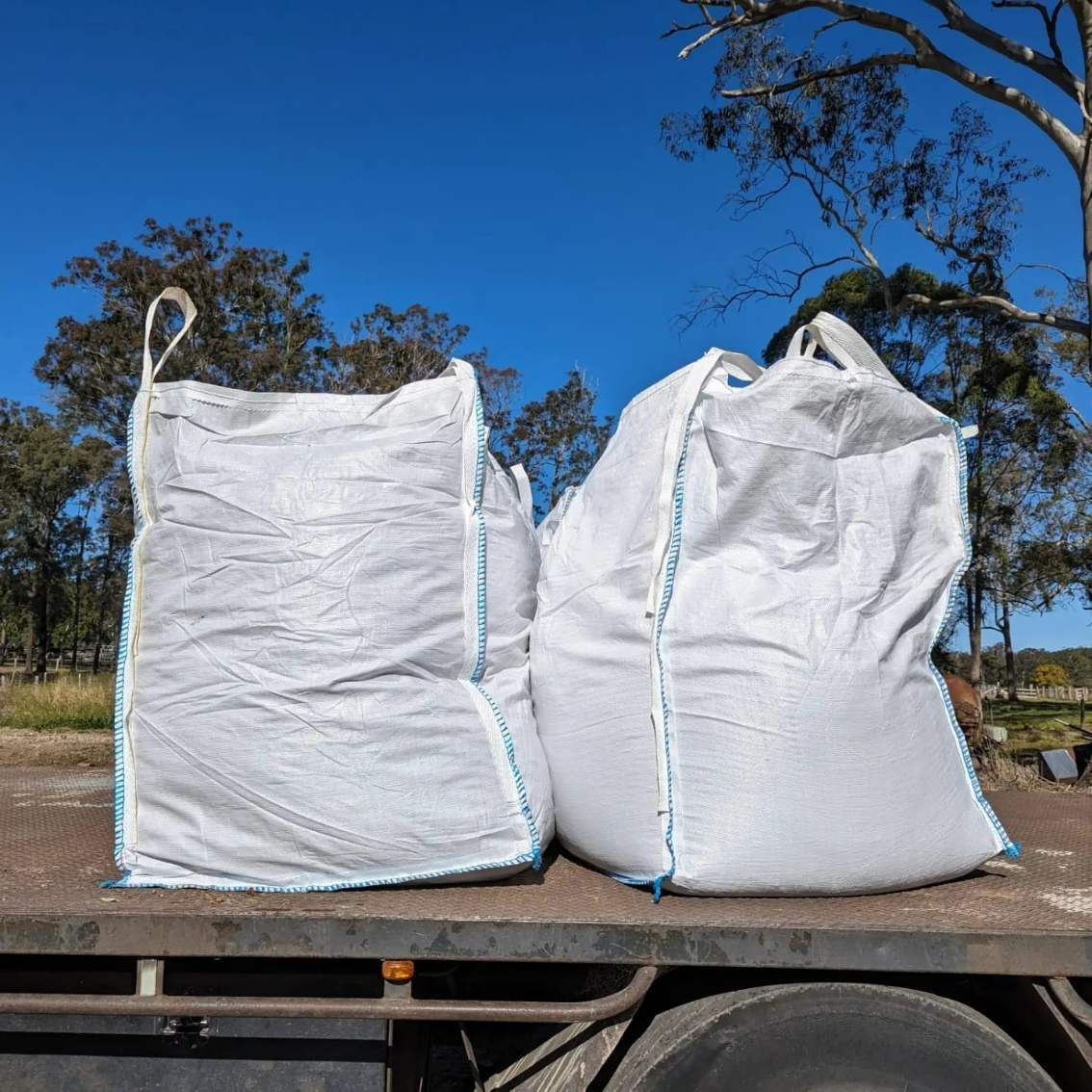 A Flatbed Truck With Bulk Bags — HKL Landscape Supplies in Taree, NSW 