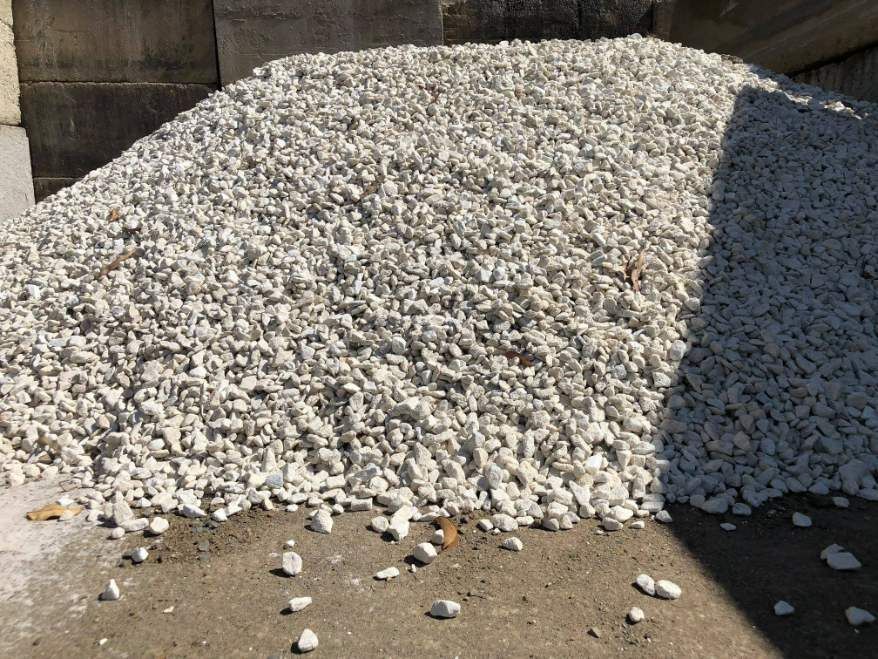 A Pile of White Gravel is Sitting on the Ground — HKL Landscape Supplies in Hallidays Point, NSW