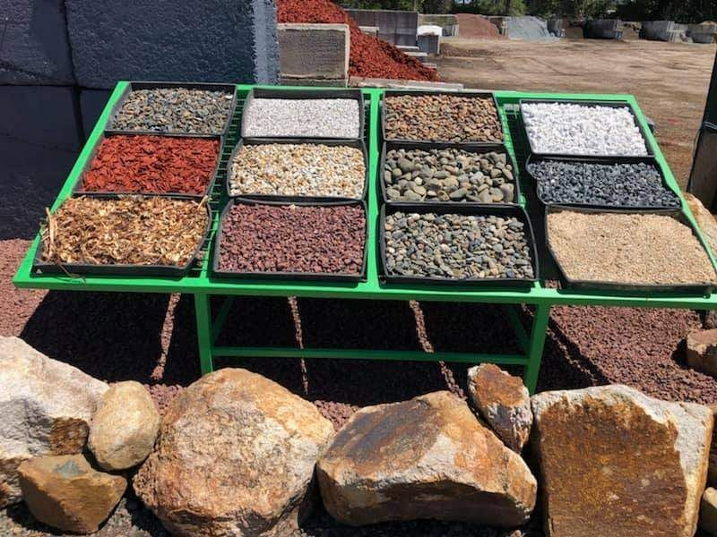 A Green Table With A Variety Of Rocks On It — HKL Landscape Supplies in Taree South, NSW