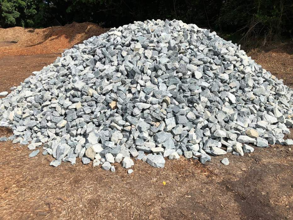 A Pile of Gravel is Sitting on Top of a Dirt Field — HKL Landscape Supplies in Hallidays Point, NSW