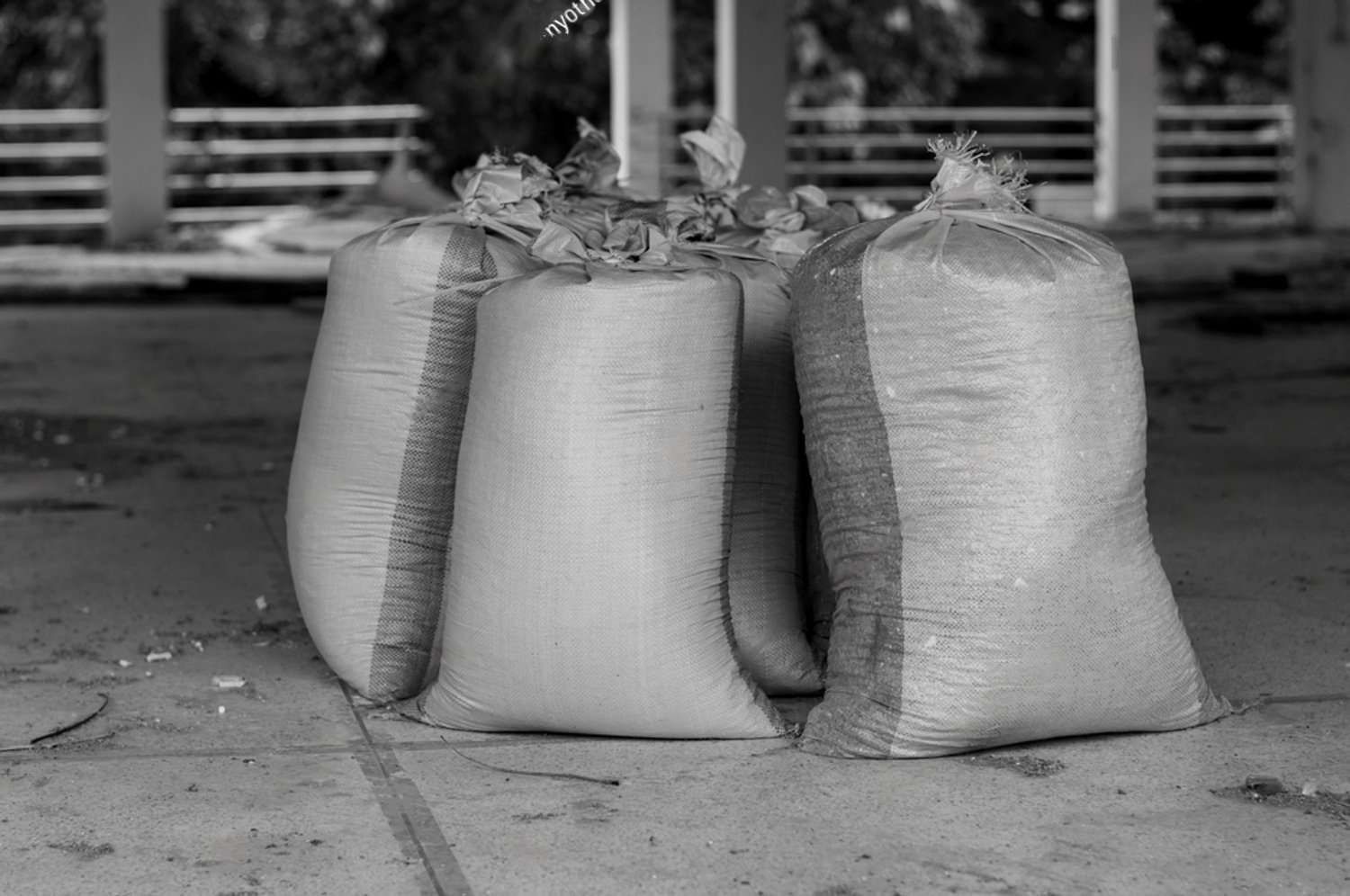 A Black And White Photo Of Three Bags Stacked On Top Of Each — HKL Landscape Supplies in Coolongoolook, NSW