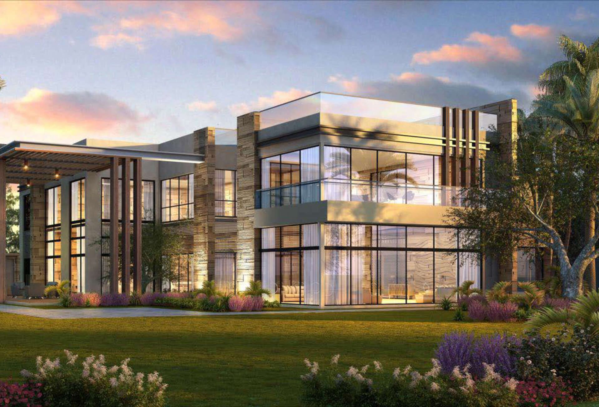 Modern, two-story house with glass walls, stone accents, and a landscaped lawn.