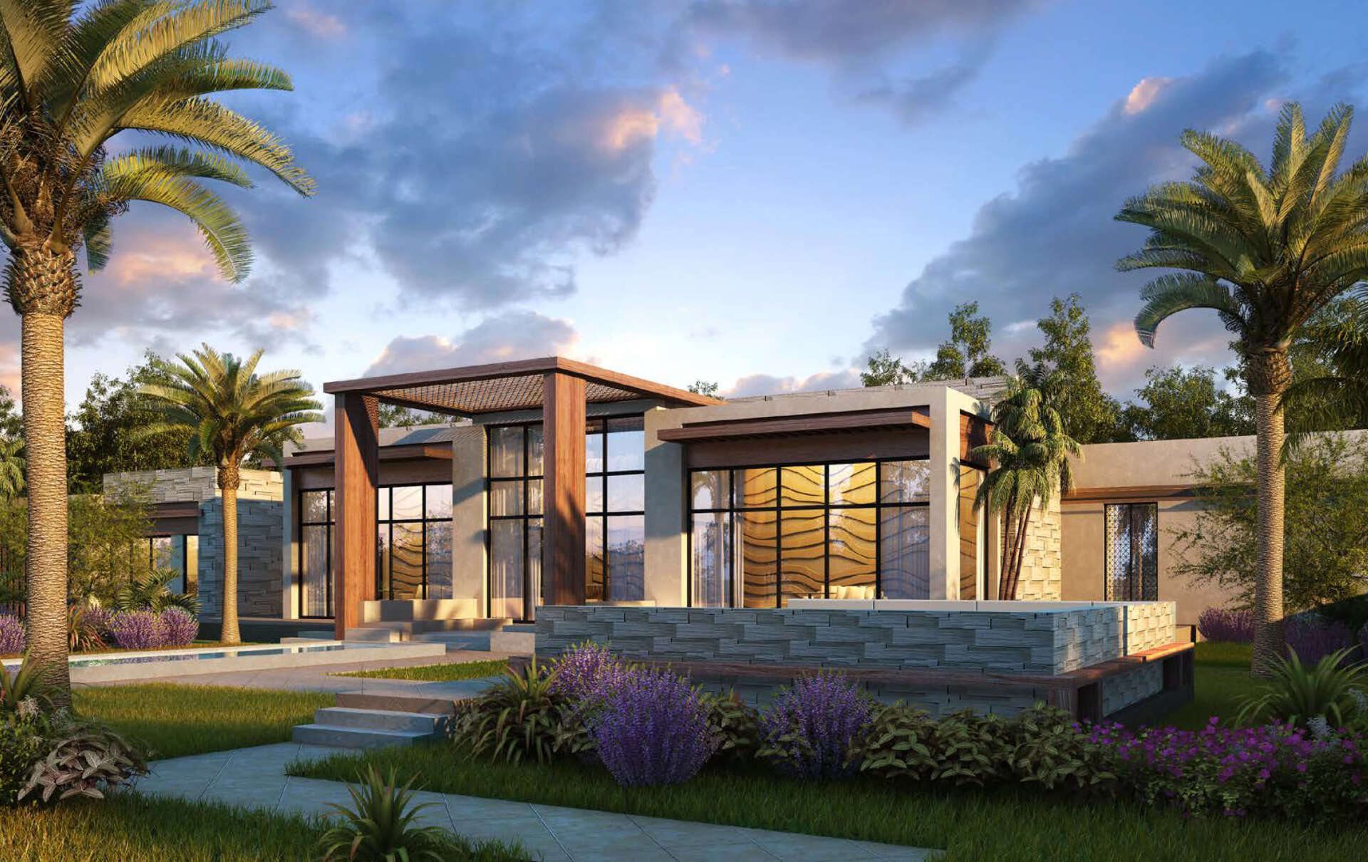 Modern home with large windows, stone accents, and lush landscaping with palm trees under a cloudy sky.