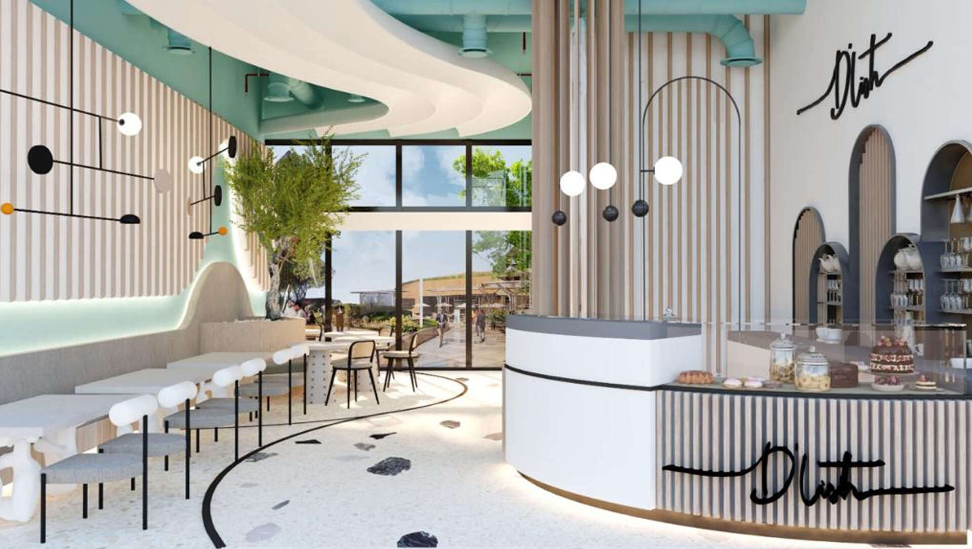 A light and airy cafe with white and mint green accents, tables, and a bakery counter.