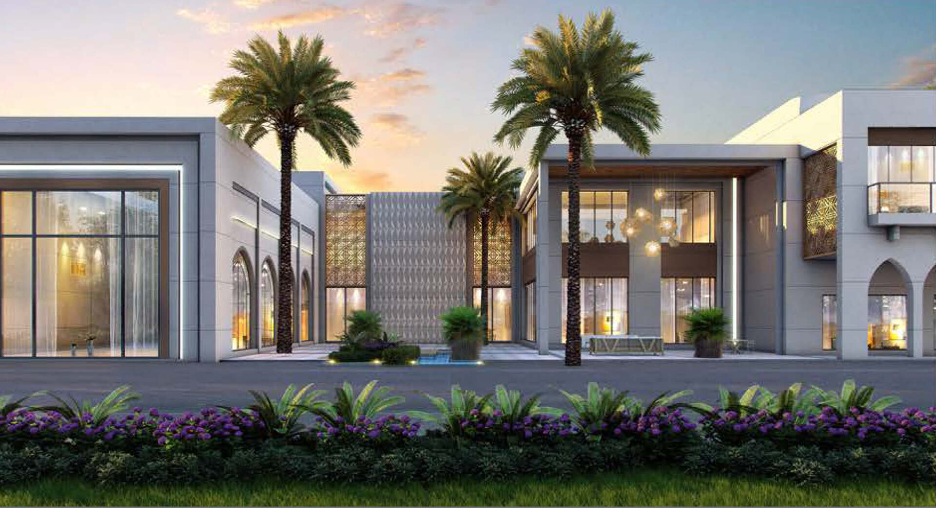 Modern building exterior with palm trees, purple flowers, and sunset sky.