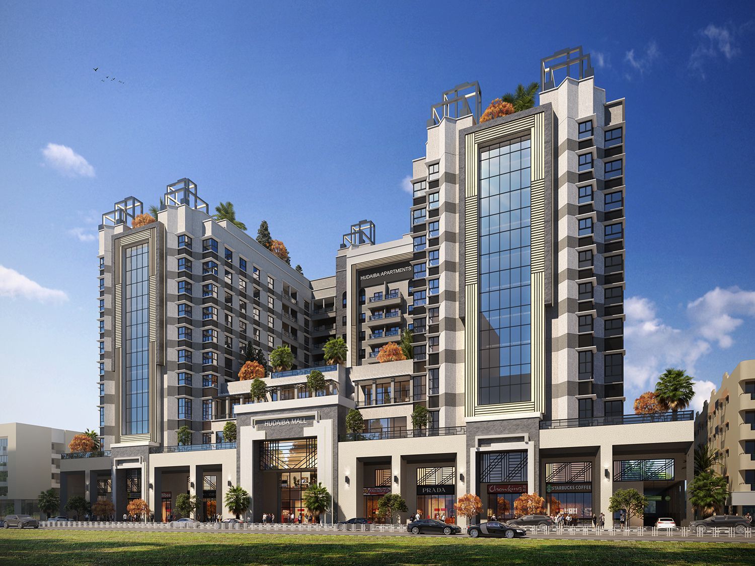 Modern apartment complex with glass panels, beige facade, and outdoor terraces under a blue sky.