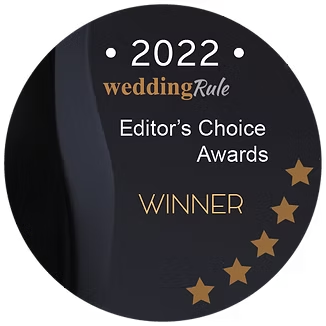 A circular black award badge for the 2022 weddingRule Editor's Choice Awards, featuring five gold stars.