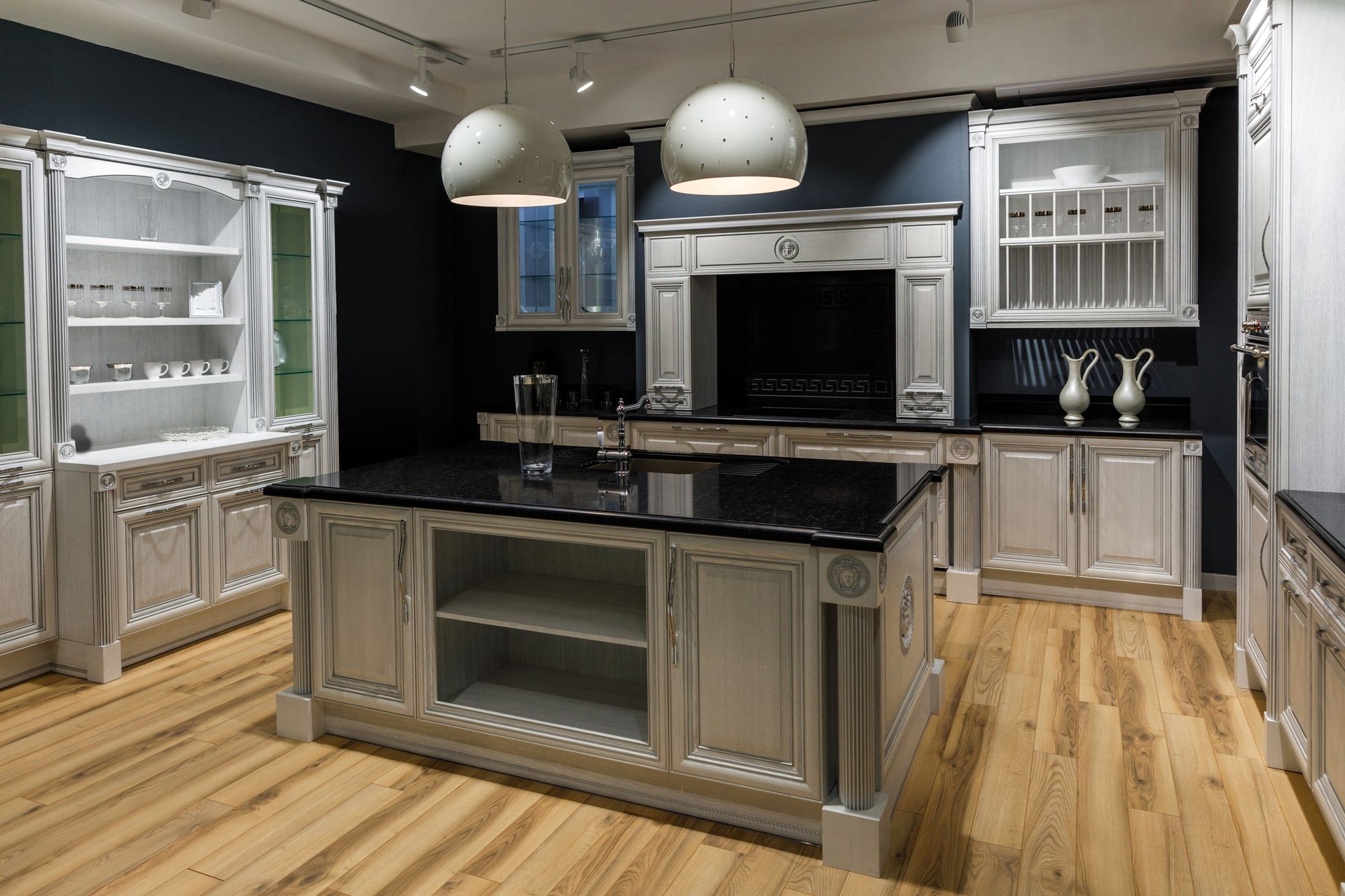 Custom luxury kitchen cabinets with island, built-in storage, and detailed craftsmanship in a modern