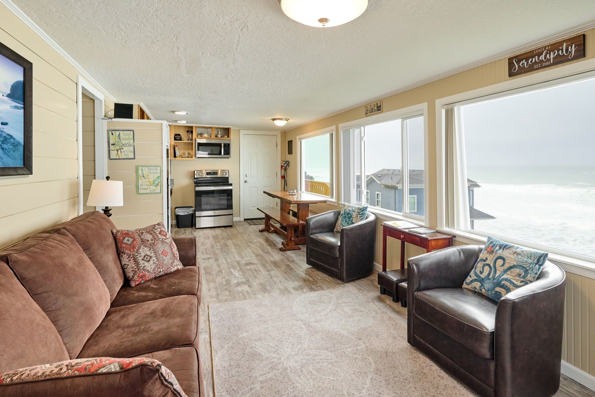 A living room with a couch and two chairs