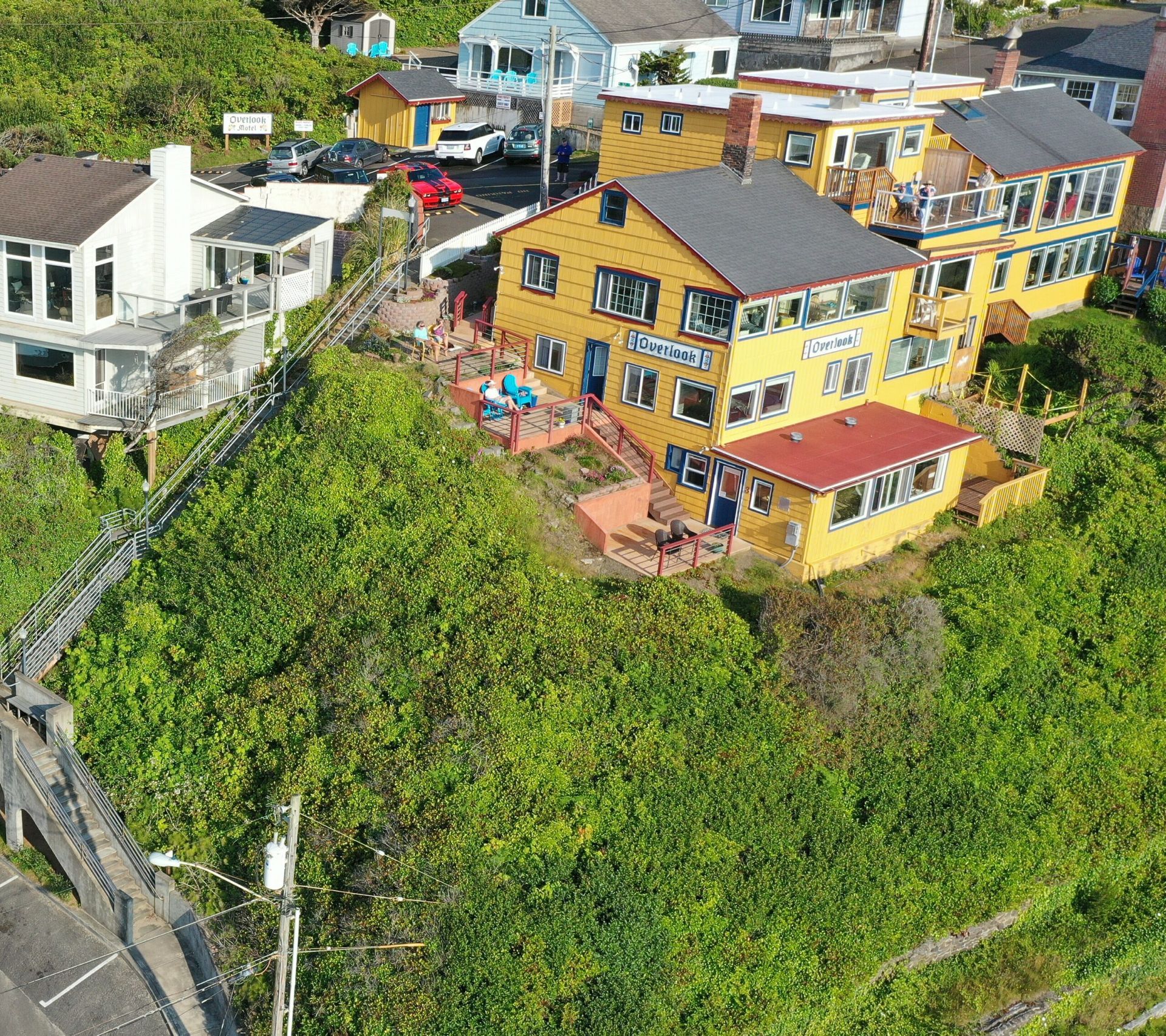An aerial view of a residential area with houses on a hill