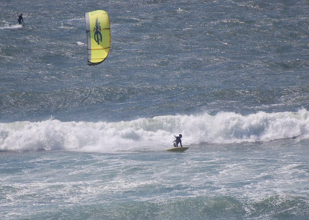 A person is riding a wave on a surfboard in the ocean