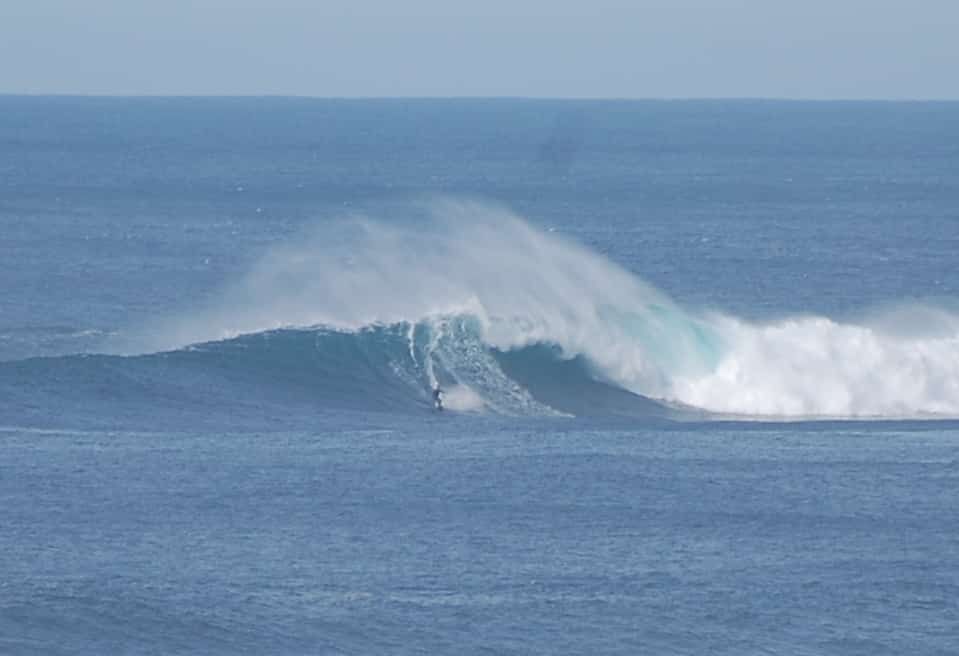 A surfer is riding a wave in the ocean.