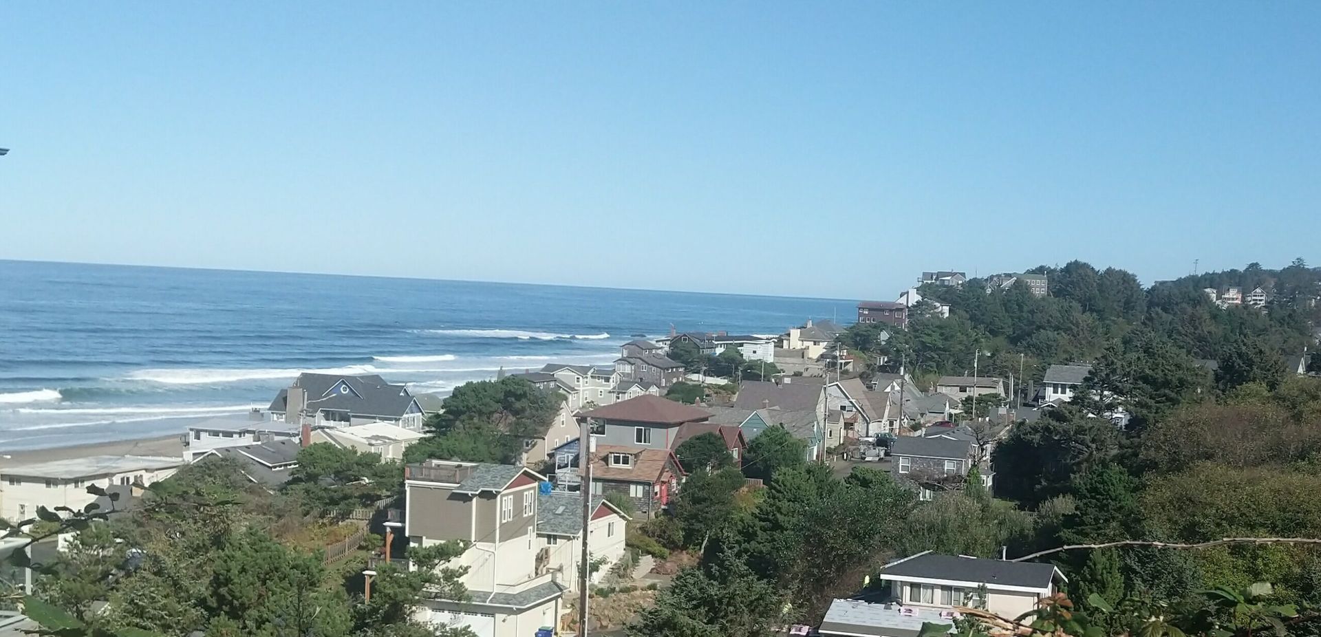 An aerial view of a residential area near the ocean