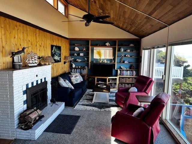 A living room filled with furniture and a fireplace