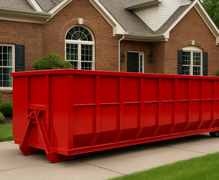 A red dumpster on the driveway