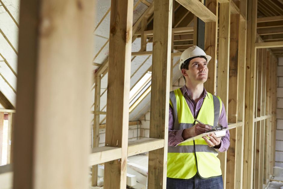 male engineer inspecting the house structure