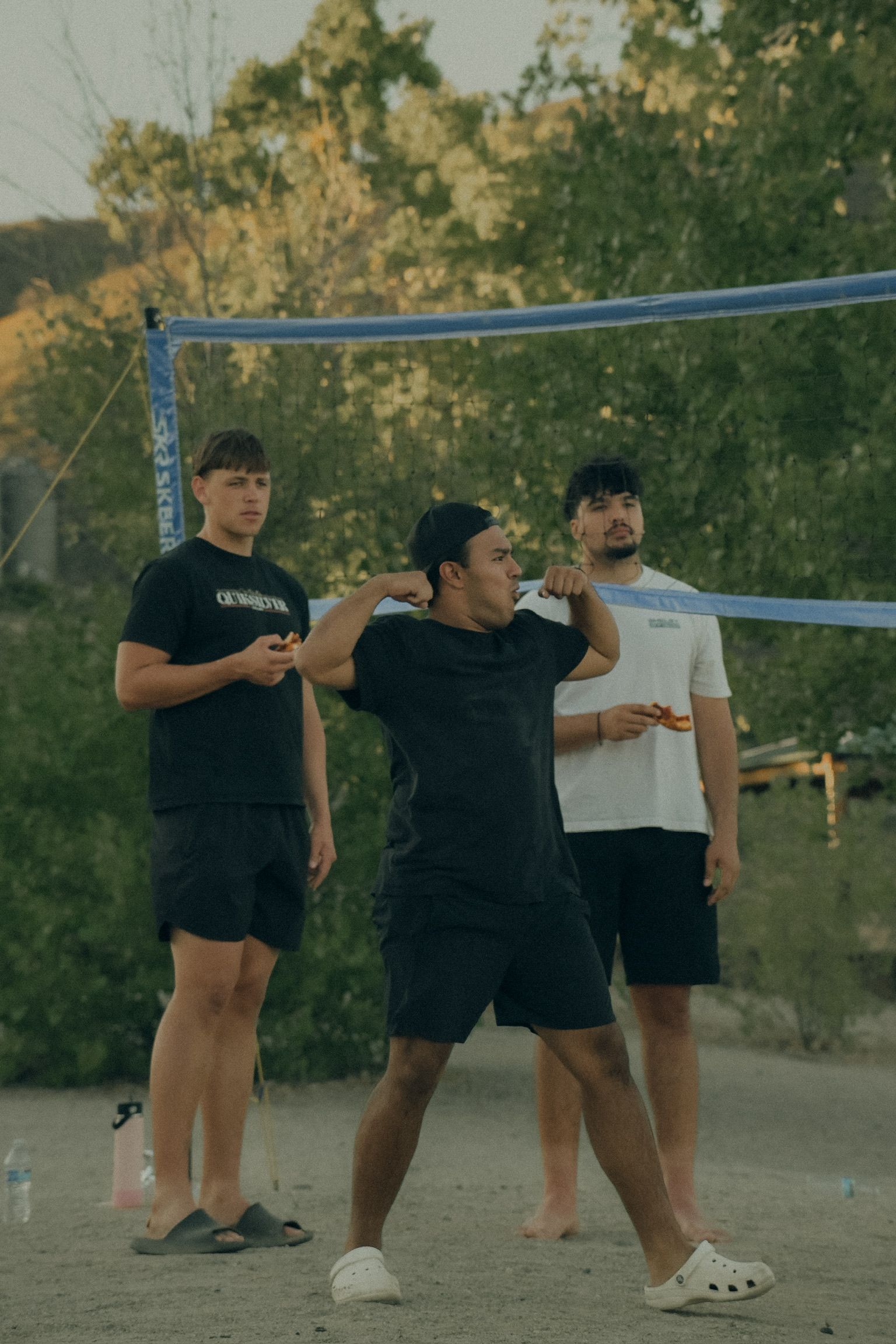 boys playing volleyball outside